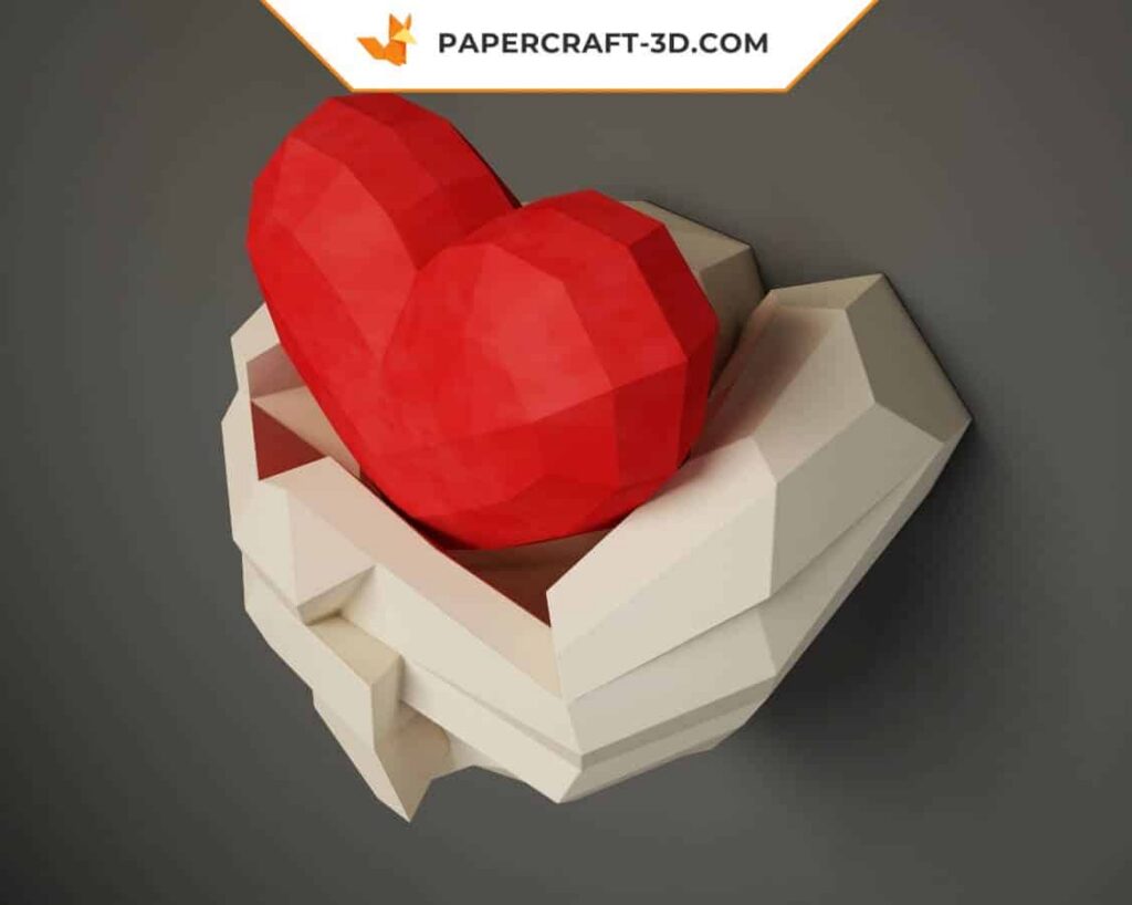 Papercraft mains tenant un cœur en origami