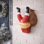 Père Noël coincé dans la cheminée